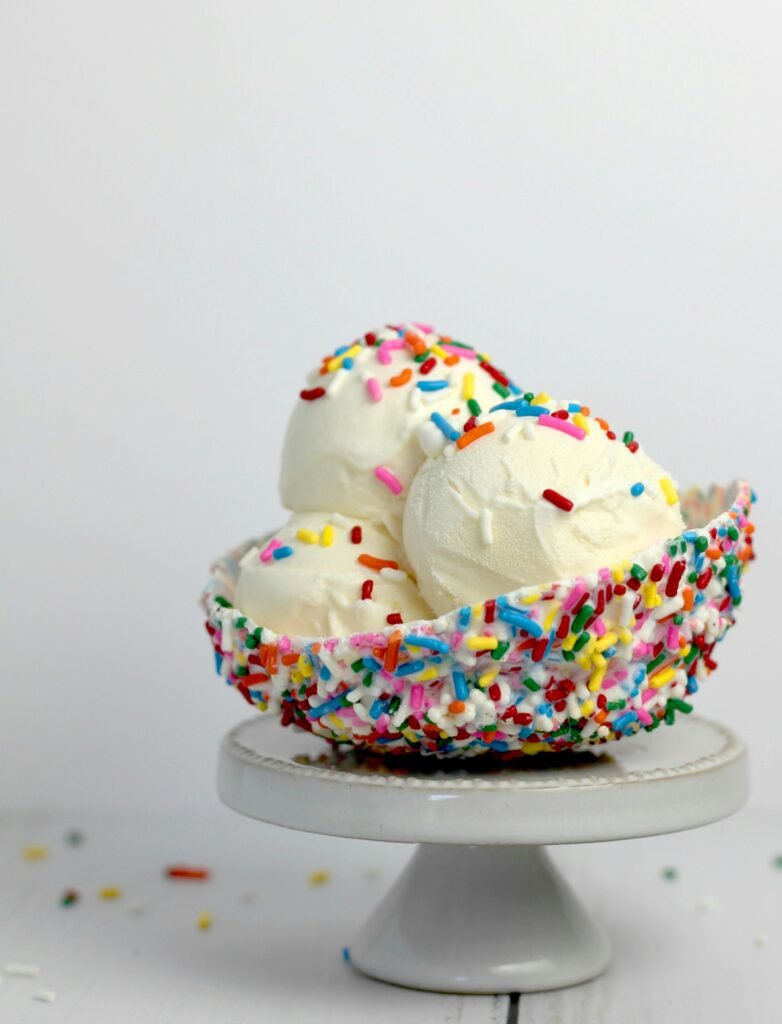 Creamy cottage cheese ice cream scoops with colorful sprinkles in a bowl